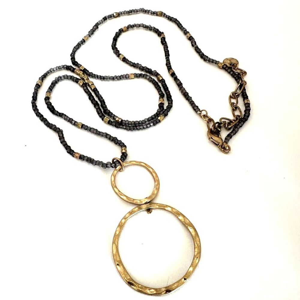 Hammered Gold Tone Circle Pendant on long grey seed bead chain
